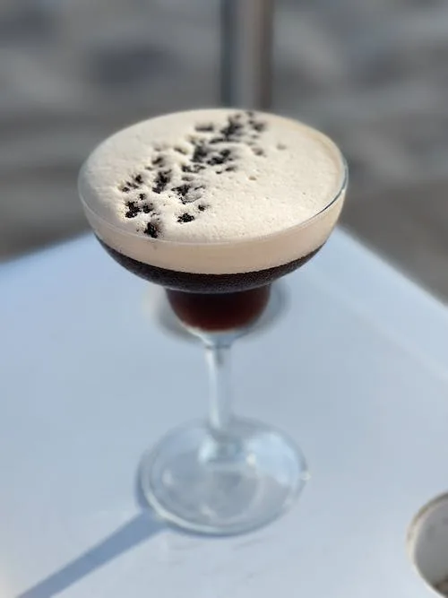 Free Espresso Martini on White Table Stock Photo